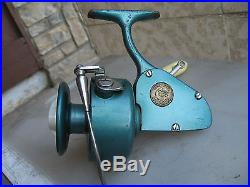 A green used PENN 705 Left Hand Spinning Reel. Made in USA, LOOK