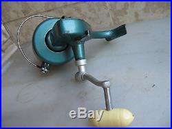 A green used PENN 705 Left Hand Spinning Reel. Made in USA, LOOK