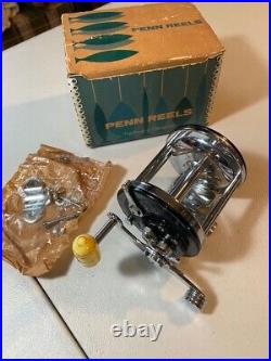 Vintage Penn Surf Master fishing reel with original box and clamp hardware